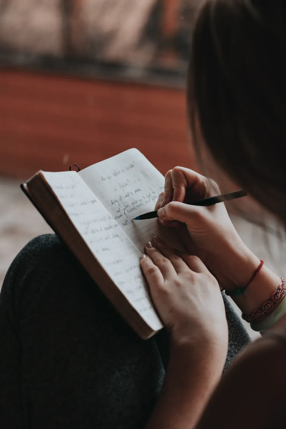 Counselling Services Writing in a notebook, building a psychological profile