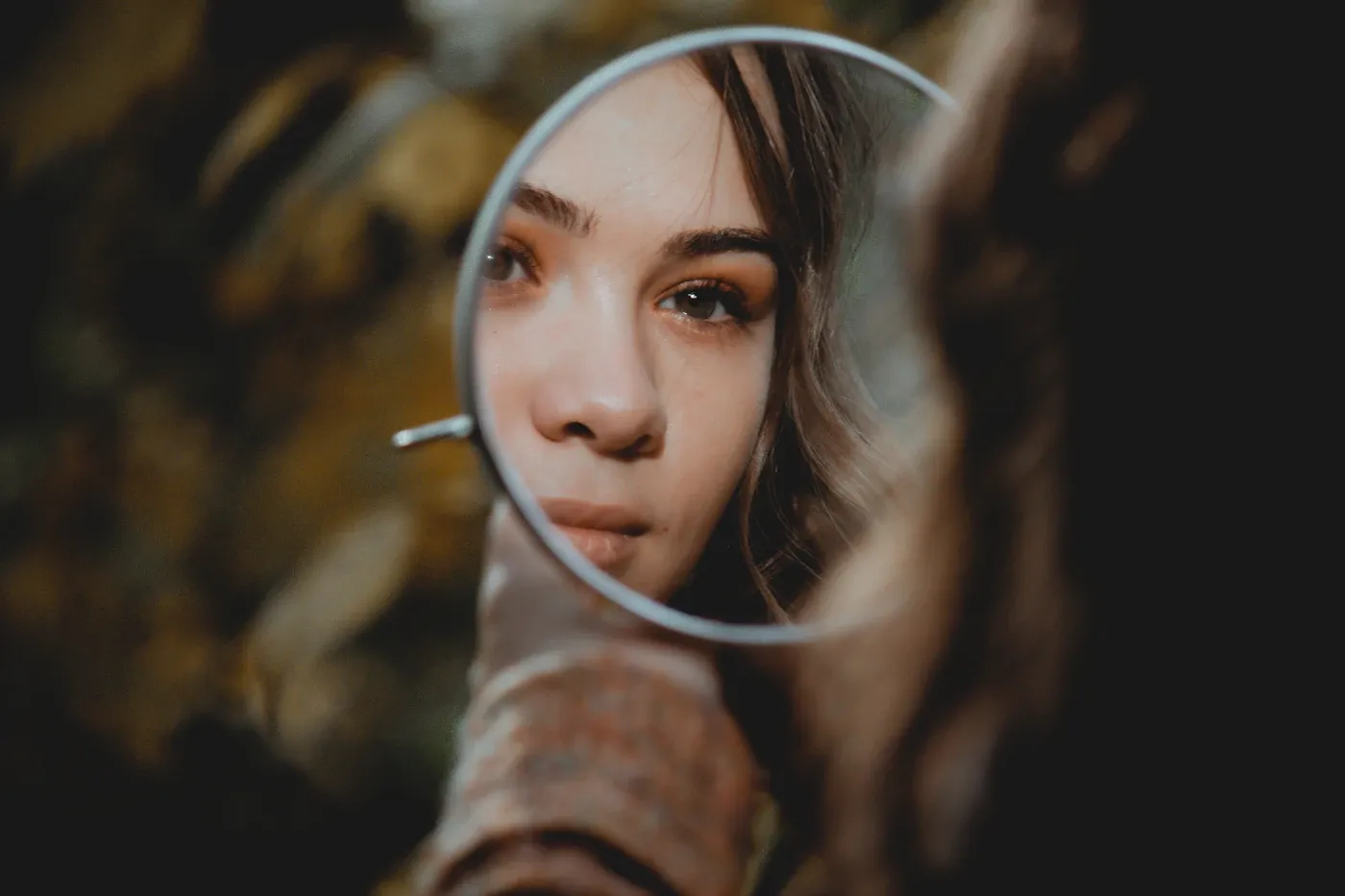 Counselling Services Woman looking into a mirror, rebuilding self-worth